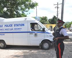 Jamaican police officer stands guard