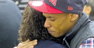 A family friend embraces Kodi’s stepmother, Cheryl Beckles, during Tuesday’s vigil in Memorial Hall. Over 1,000 Plattsburgh community members attended.