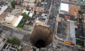 A sinkhole in the centre of Guatemala City that swallowed a three-storey building in May 2010. Photograph: Luis Echeverria/AP