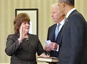 Pierson being sworn in by Obama