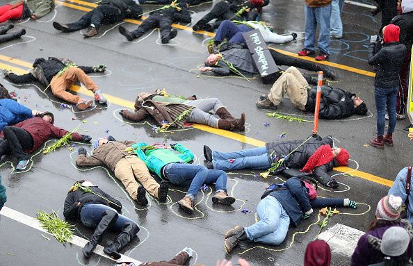 protesters simulate Michael Brown's dead body