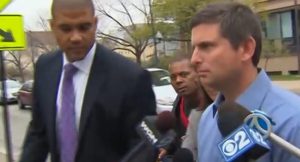 Michael Hart, right, resigned from the Skokie Police Department before it could fire him after he pushed a drunk driving arrestee into a cement bench.