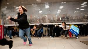 shoppers race in under grill gates to get bargains