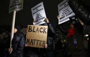 People holds a banners as they take part during a protest in support of Eric Garner at Union Square on December 3, 2014 in New York City. (Photo by Kena Betancur/Getty Images)