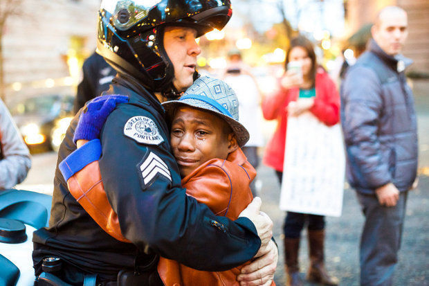 Emotional moment between little boy and cop