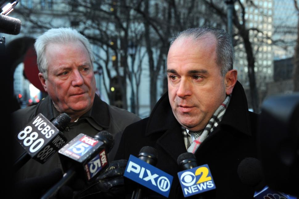 Sergeants Benevolent Association President Ed Mullins, right, blamed the decline of NYPD arrests and summons on 'a hesitancy' brought on by Eric Garner’s July 17 death in a police chokehold. 