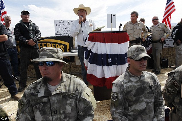 Thanks: Rancher Cliven Bundy, middle, addresses his supporters along side Clark County Sheriff Doug Gillespie, right, on April 12, 2014 Read more: http://www.dailymail.co.uk/news/article-2603026/Senator-speaks-favor-Nevada-rancher-militias-join-battle-federal-agents-accused-acting-like-theyre-Tienanmen-Square-fight-disputed-ranch-land.html#ixzz3Yi8Zuynd  Follow us: @MailOnline on Twitter | DailyMail on Facebook