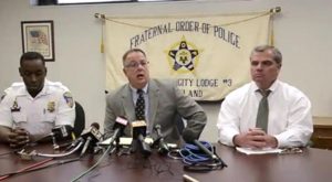 Baltimore police union lawyer Michael Davey (c) an union President Gene Ryan (r) speak to the press about the Freddie Gray case.