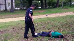 Walter Scott laying face down , and handcuffed with 5 bullets in him.