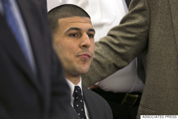 Former New England Patriots football player Aaron Hernandez listens as the guilty verdict is read during his murder trial at the Bristol County Superior Court in Fall River, Mass., Wednesday, April 15, 2015.  Hernandez was found guilty of first-degree murder in the shooting death of Odin Lloyd in June 2013.  He faces a mandatory sentence of life in prison without parole.  (Dominick Reuter/Pool Photo via AP)