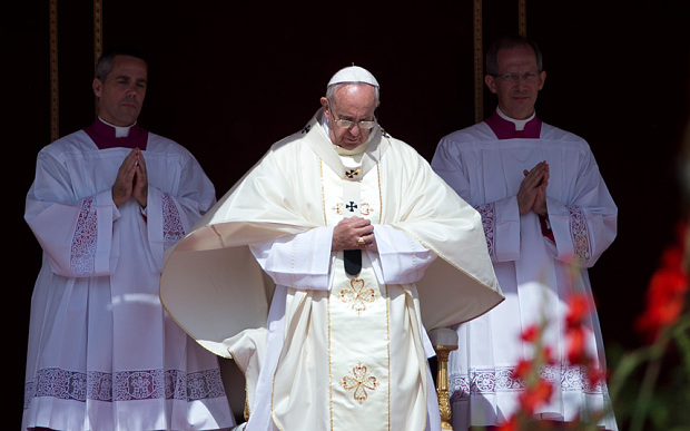 Pope Francis arrives to celebrate a canonization ceremony of four new saints in St. Peter's Square at the Vatican  Photo: AP Photo/Alessandra Tarantino