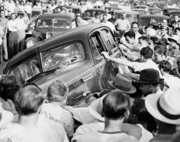 In August 1919, a race riot in Knoxville, Tenn., broke out after a white mob mobilized in response to a Black man accused of murdering a white woman. The 5,000-strong mob stormed the county jail searching for the prisoner. They freed 16 white prisoners, including suspected murderers. After looting the jail and sheriff’s house, the mob moved on and attacked the African-American business district. Many of the city’s Black residents, aware of the race riots that had occurred across the country that summer, had armed themselves, and barricaded the intersection of Vine and Central to defend their businesses. Two platoons of the Tennessee National Guard’s 4th Infantry led by Adjutant General Edward Sweeney arrived, but they were unable to halt the chaos. The mob broke into stores and stole firearms and other weapons on their way to the Black business district. Upon their arrival the streets erupted in gunfire as Black snipers exchanged fire with both the rioters and the soldiers. The Tennessee National Guard at one point fired two machine guns indiscriminately into the neighborhood, eventually dispersing the rioters. Shooting continued sporadically for several hours. Outgunned, the Black defenders gradually fled, allowing the guardsmen to gain control of the area. Newspapers placed the death toll at just two, though eyewitness accounts suggest the dead were so many that the bodies were dumped into the Tennessee River, while others were buried in mass graves outside the city.