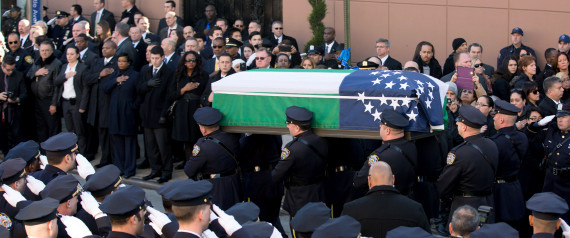 NEW YORK, NY - DECEMBER 27:  Pallbearers carry the casket during the funeral of slain New York Police Department (NYPD) officer Rafael Ramos at the Christ Tabernacle Church on December 27, 2014 in the Glenwood section of the Queens borough of New York City. Ramos was shot, along with Police Officer Wenjian Liu while sitting in their patrol car in an ambush attack in Brooklyn on December 20. Thousands of fellow officers, family, friends and Vice President Joseph Biden arrived at the church for the funeral.  (Photo by Kevin Hagen/Getty Images)