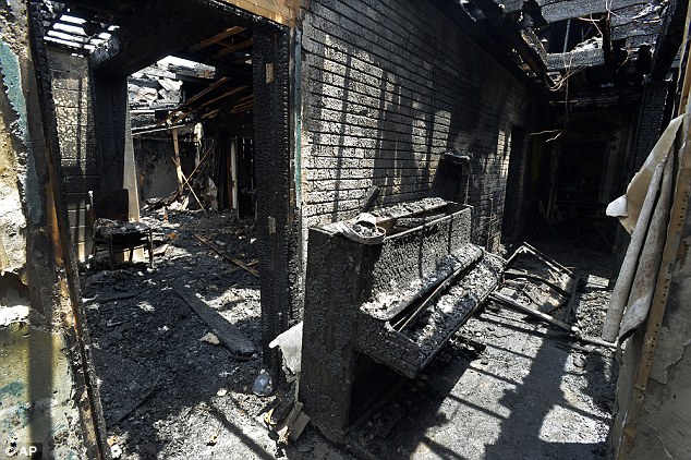 Blackened: Pictured is the interior of Briar Creek Road later Wednesday, after the blaze had died down Read more: http://www.dailymail.co.uk/news/article-3142817/String-suspected-arson-attacks-SIX-black-churches-stretching-Georgia-Ohio-burned-single-week.