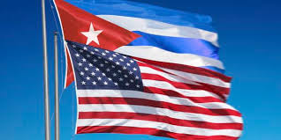 The American and Cuban Flags fly side by side as a symbol of a new day in relations between the two countries..