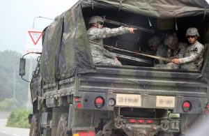 STRINGER/EPA Paju, South Korea U.S. troops in a truck in the South Korean town of Paj bordering North Korea on Aug. 21, 2015, amid heightened tensions raised by the two Koreas' shelling across the inter-Korean border the previous day.