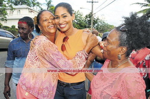 St Ann South Eastern MP Lisa Hanna (centre) is embraced by supporters after she emerged as the winner of yesterday’s People’s National Party candidate selection at Ferncourt High School in the parish. (PHOTO: MICHAEL GORDON)