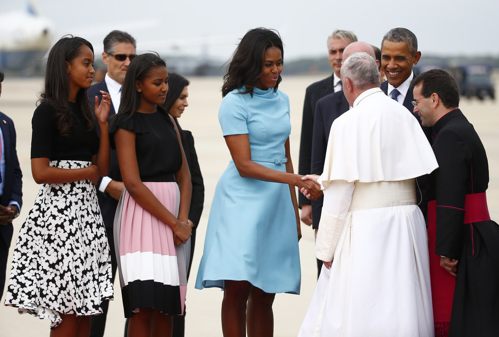 President Obama ,first Lady Michelle Obama and their two daughters greets the Pope ..