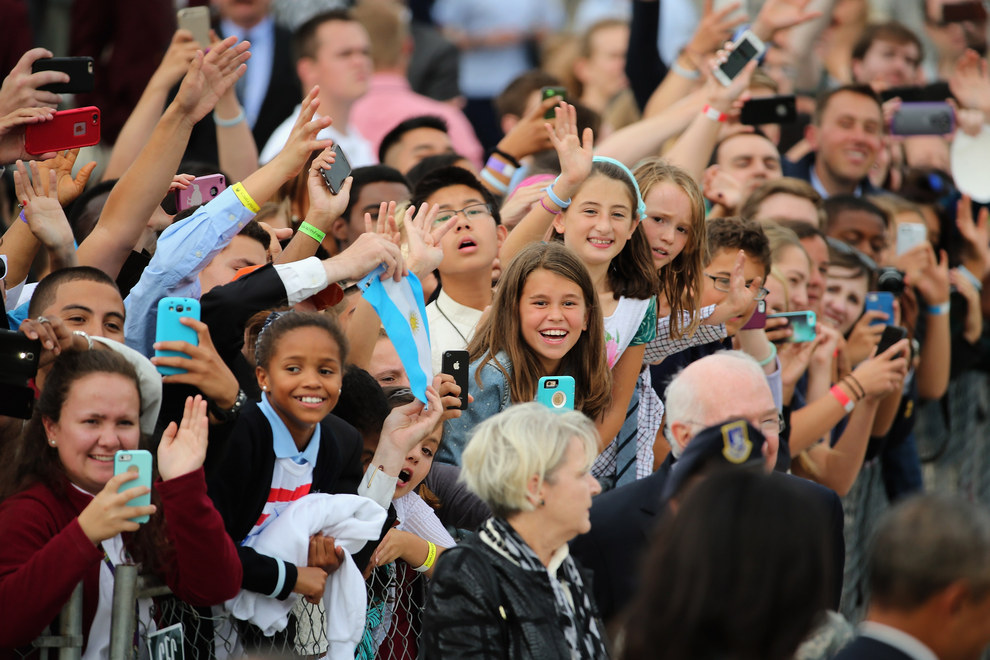 Excited Nuns and other well-wishers wait patiently to catch a glimpse of the Pontiff..