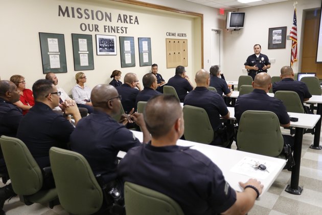 LOS ANGELES, CA - AUGUST 31: Los Angeles Police Department Sgt. Dan Gomez with information technology bureau briefs LAPD officers on the use of body cameras during a training session at Mission Station on August 31, 2015 in Los Angeles, California. Over 7,000 officers will be outfitted with the cameras in the coming months, with the first round rolling out today. (Photo by Al Seib/Los Angeles Times via Getty Images)