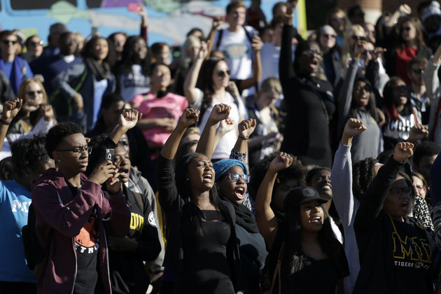 Students cheer while listening to members of the black student protest group, Concerned Student 1950, speak following the announcement University of Missouri System President Tim Wolfe would resign Monday, Nov. 9, 2015, at the University of Missouri in Columbia, Mo. Wolfe resigned Monday with the football team and others on campus in open revolt over his handling of racial tensions at the school. (AP Photo/Jeff Roberson)