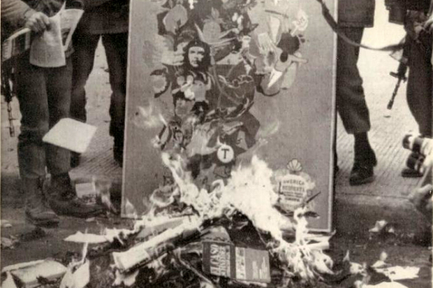 Pinochet’s soldiers burning left-wing books after the 1973 U.S.-backed coup in Chile (Credit: CIA FOIA/Weekly Review)