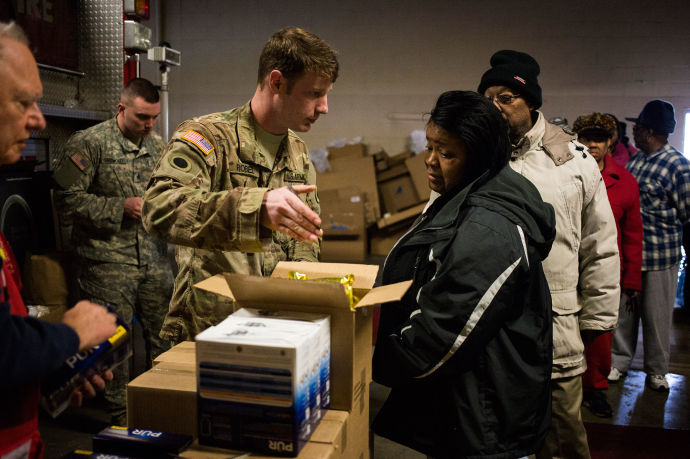 The National Guard has arrived in Flint, Michigan, passing out bottled water and filters in an effort to protect residents from the city’s tainted water supply. CREDIT PHOTOGRAPH BY BRITTANY GREESON / THE NEW YORK TIMES / REDUX