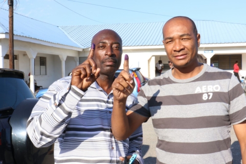 Sergeant Donovan Shaw (left) and Corporal Warren Chong after casting their ballots at Harman Barracks in St Andrew this morning.