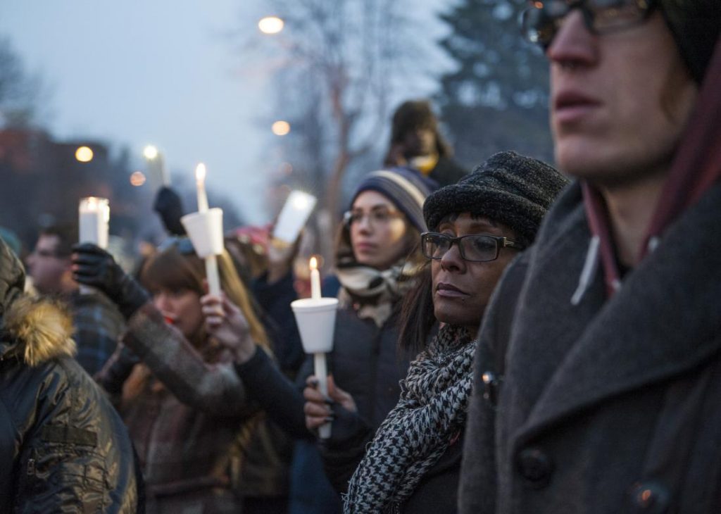 MINNEAPOLIS, MN -  NOVEMBER 20: Protestors, activists, and community members listen to a speech by Nekima Levy-Pounds, Minneapolis NAACP president, at a candlelight vigil held for Jamar Clark outside the 4th police precinct November 20, 2015 in Minneapolis, Minnesota. Activists are keeping up pressure for more information about the shooting death of Clark by a Minneapolis police officer (Photo by Stephen Maturen/Getty Images)