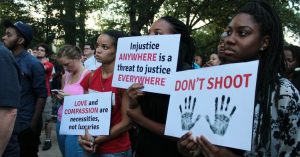 Protesters line up to protest police killing Michael Brown in Ferguson Missouri.